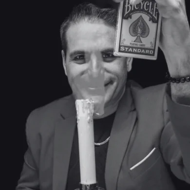 Lex's hands performing a sleight of hand, demonstrating his skill